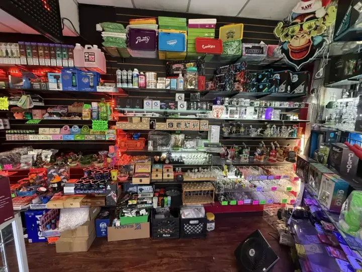 Vape counter stocked with disposables and e-liquid at Smoker's Alley on Gratiot Ave in Roseville