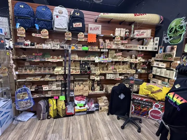 Street-art walls and stocked shelves inside Smoker's Alley Gallery on 13 Mile Rd in Roseville, MI