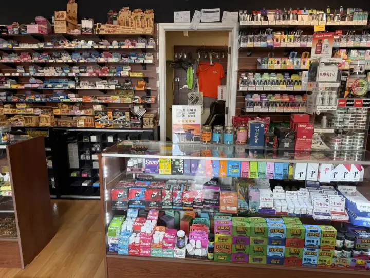 Front counter and stocked shelves by the doorway at Smoker's Alley, 29035 Gratiot Ave