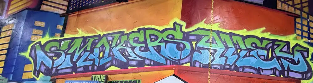 The spray-painted Smokers Alley mural inside the Gallery on 13 Mile